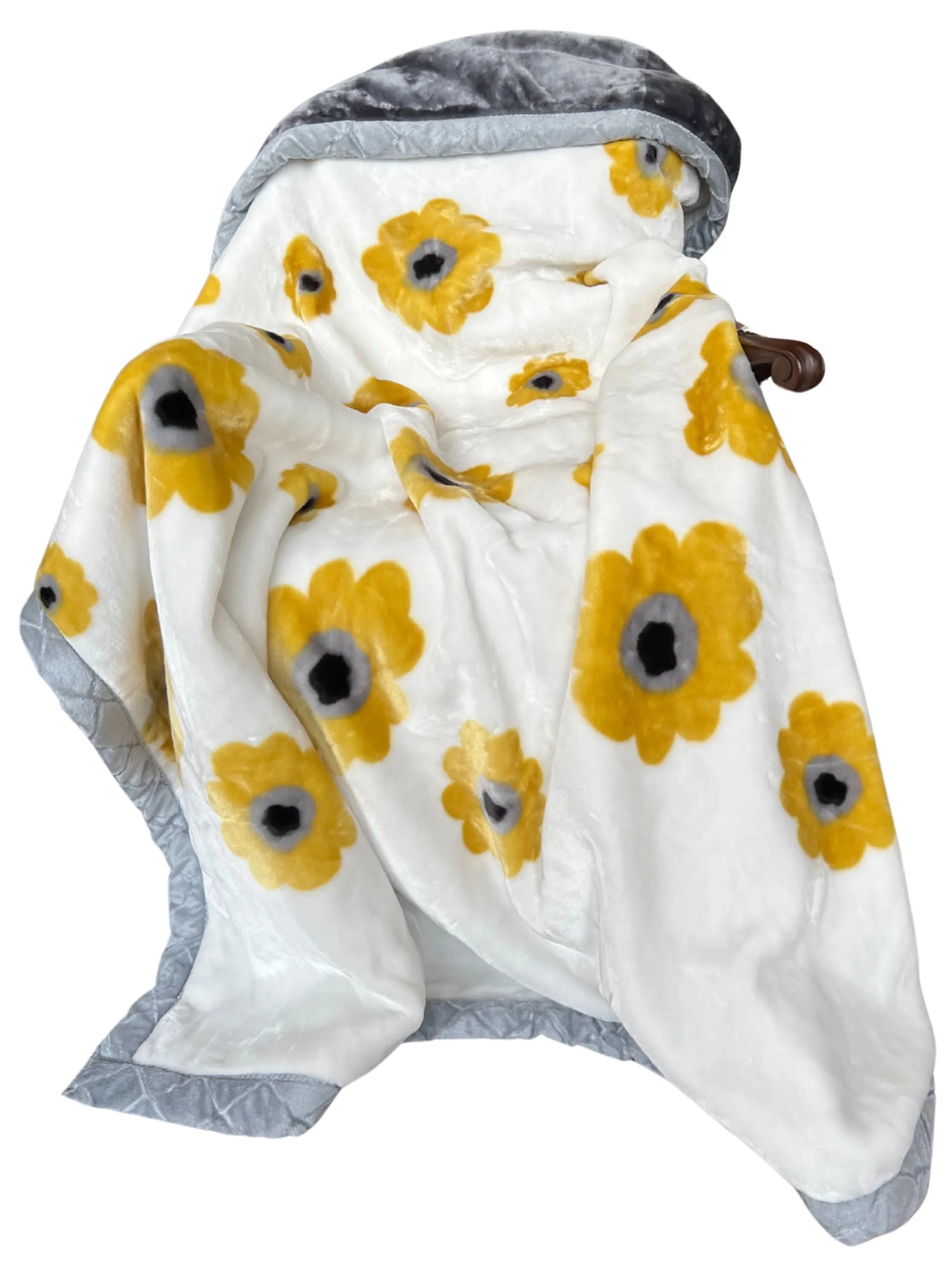 Raschel blanket, sunflower-style yellow flowers, draped display